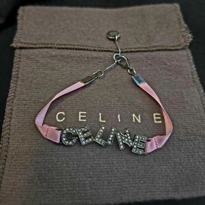 Celine logo bracelet with pink ribbon band and rhinestone-embellished